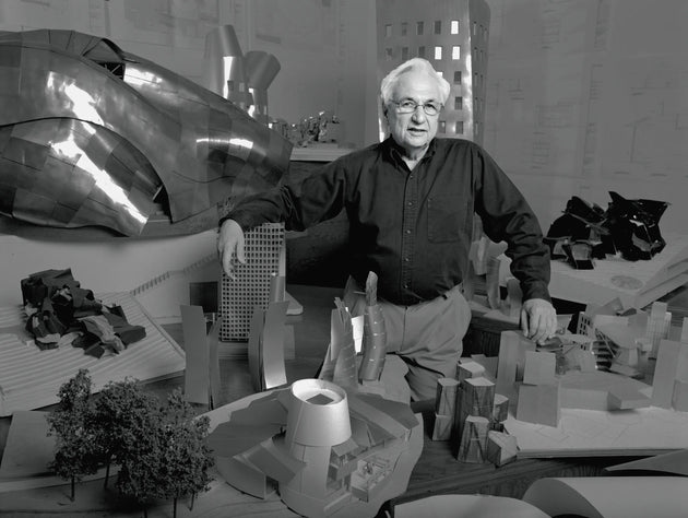 Frank Gehry with miniatures of his designs in Los Angeles, 1989. Photo by Bonnie Schiffman. Via Vanity Fair