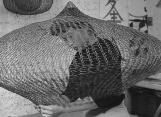 Imogen Cunningham, Ruth Asawa, 1957. Image © 2024 Imogen Cunningham Trust. All Rights Reserved. Art © 2024 Estate of Imogen Cunningham / 2024 Ruth Asawa Lanier, Inc. / Artists Rights Society (ARS), New York. Courtesy David Zwirner via Sotheby's