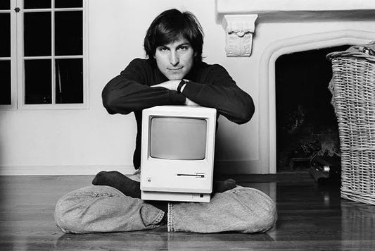 Steve Jobs with Mac via The Verge
