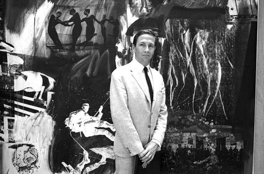 Ugo Mulas, Robert Rauschenberg in front of his silkscreen painting Express, 1963, at the XXII International Biennale of Art Exhibition, Venice, 1964. © Ugo Mulas Heirs. All rights reserved. Via the Robert Rauschenberg Foundation.
